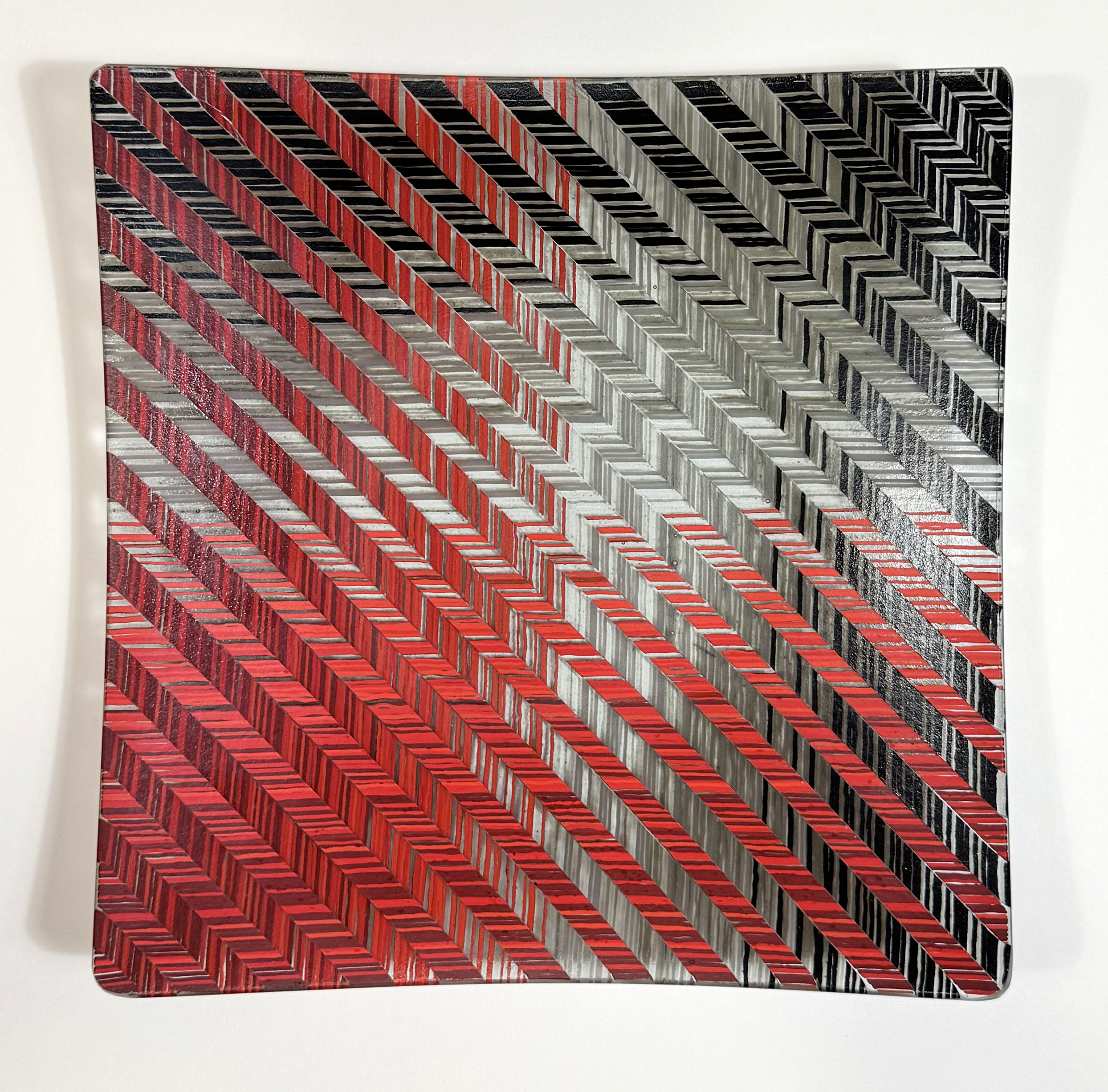 Fused glass plate in Herringbone Weave in Red, Black & Gray by Diane Willkens